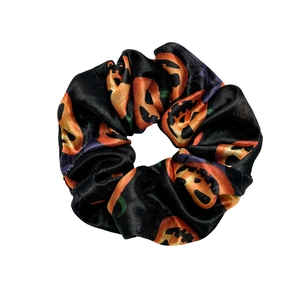 Halloween scrunchie in black satin with orange pumpkin Jack-o'-lantern festive pattern