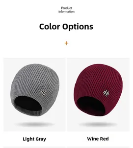 Detail of light grey and wine red knit beanies with warm lining and metal accents