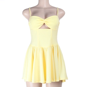 Detail of light yellow mini dress featuring chest twist knot and triangle cutout design