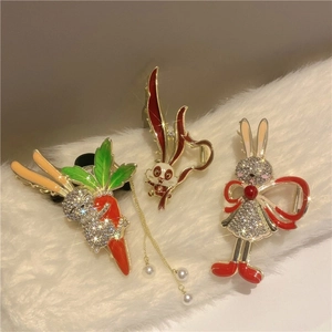 Three Chinese style rabbit hair claws with pearls, rhinestones and enamel tassels