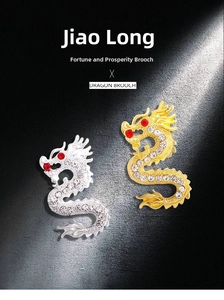 Détails macro des broches dragon en or et argent avec strass et yeux en gemme rouge