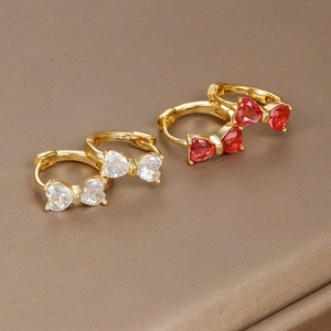 Exquisite 18K gold bow hoop earrings with red and white zircons on textured fabric
