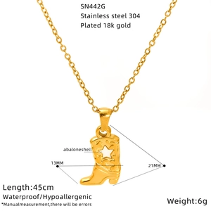 Detail of vintage cowboy boot pendant in 18K gold plated stainless steel with size info