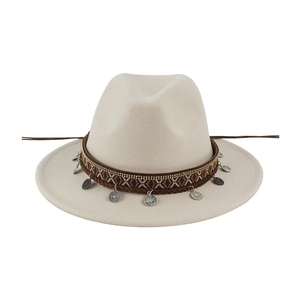 Detail view of ethnic embroidered band with silver coin pendants on a felt fedora