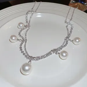 Elegant double-layer silver necklace with sparkling rhinestones and white pearl pendants