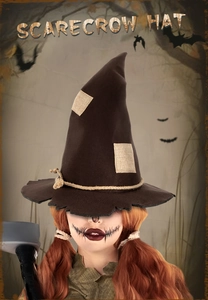 Detail of dark brown scarecrow witch hat with burlap patches and rustic hemp rope texture