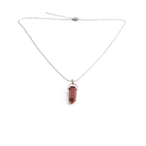 Silver chain necklace with a red hexagonal prism imperial stone pendant on white background