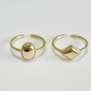 Adjustable gold geometric rings with oval and rhombus shapes and beaded edge details