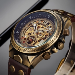 Detailed macro view of the skeleton mechanical watch face with golden gears and bronze bezel