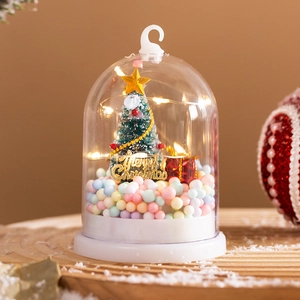 Luminous Christmas tree in glass dome with LED lights and miniature gift decor