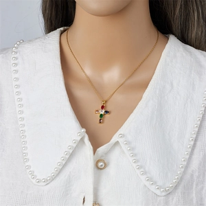 Golden titanium steel cross necklace with colorful zircon stones on model