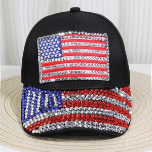Macro shot of colorful rhinestones forming the American flag on a black denim cap