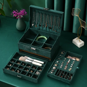 Three-layer dark green velvet jewelry box with drawers for rings and necklaces storage