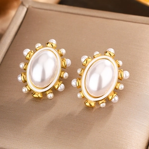 French vintage 18K gold earrings with large oval white pearls and small bead accents