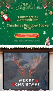 Detail of Christmas reindeer antler window clings and Merry Christmas glass stickers