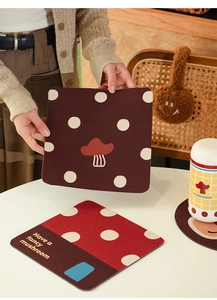Detail of absorbent diatom mud coaster with cute mushroom pattern and heat resistance