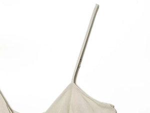 Detailed close-up of light gray spaghetti strap and soft fabric texture for women dress