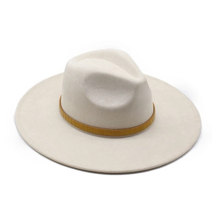 Detail of off-white wide brim suede fedora with brown crocodile texture hat band