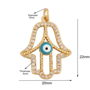 Detail of Hamsa Hand pendant with cubic zirconia and blue evil eye bead charm