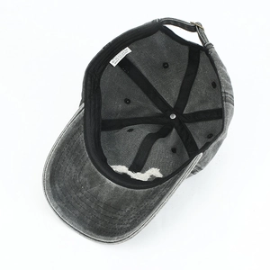 Detail view showing gray washed cotton cap interior construction and adjustable metal buckle