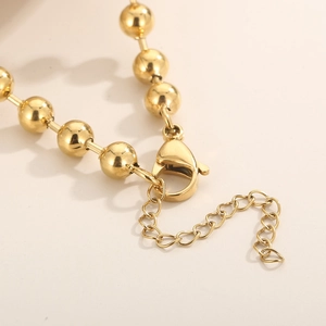 Golden stainless steel beaded chain necklace and bracelet set with lobster clasp