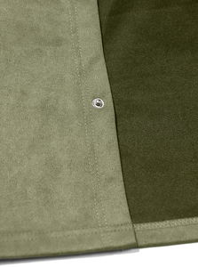 Detailed macro view of olive green faux suede fabric with silver metal snap buttons