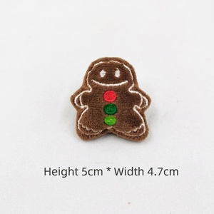 Detail of 5x4.7cm gingerbread man plush brooch with festive embroidery for DIY decoration