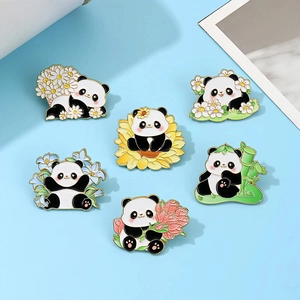 Cute panda enamel pin set with sunflower and floral motifs on blue background