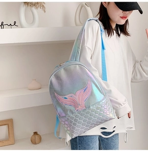 Detail of laser holographic mermaid backpack with pink fin embroidery and scale textures