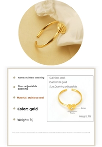 Detail of 18K gold plated adjustable rings with rose and heart zircon patterns