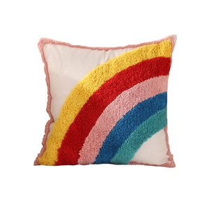 Rainbow tufted decorative pillow with colorful tassels and soft white cotton canvas fabric