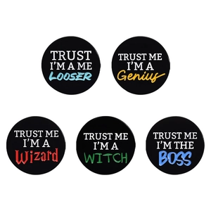 Set of five black round geometric pins with colorful humor text Trust Me I am the Boss