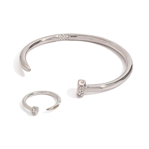 Silver steel nail jewelry set featuring an open bangle and ring with pavé crystal accents