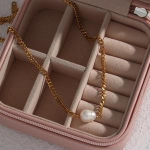 Golden stainless steel Cuban chain necklace with freshwater pearl in a pink jewelry box