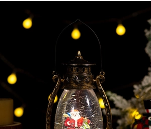 Close-up of vintage bronze Christmas lantern with Santa snow globe and warm LED light effect