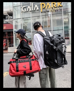 Durable Oxford fabric travel bags in red and black colors with versatile straps