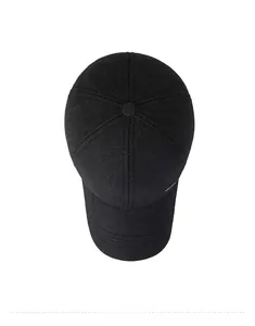 Top view of a black winter wool baseball cap with thick texture and side metal detail