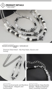 Detail of titanium steel necklace with white pearls, black beads and skull pendant
