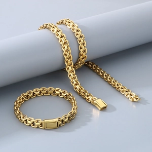 Detail view of 10mm gold stainless steel woven link chain necklace and bracelet set