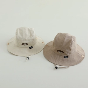 Close-up of boys outdoor sun hats with lucky embroidery and adjustable windproof cords