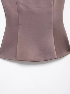 Detail shot of the smooth satin hem and high-quality stitching on a mauve blazer set