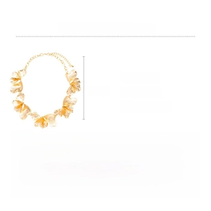 Detailed view of large golden alloy flower necklace with brushed metal texture and 53cm chain