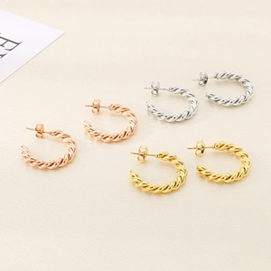 Trois paires de boucles d'oreilles créoles torsadées en or rose, argent et or brillant