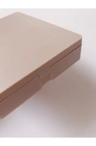 Detail view of the matte finish and secure closure of the compact makeup brush case