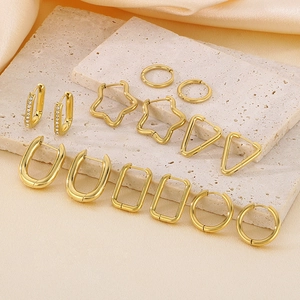 Golden geometric stainless steel earrings set including star, U-shape and round hoops