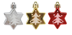 Detailed view of red, gold, and silver star ornaments with white glitter tree patterns