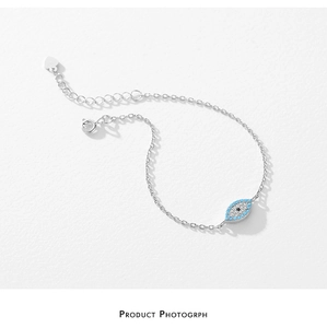 Detail of S925 sterling silver evil eye bracelet with turquoise diamonds and lobster clasp