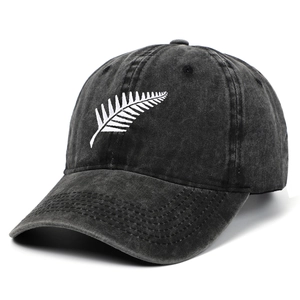 Vintage black washed cotton baseball cap with white silver fern embroidery for outdoors