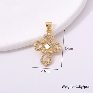 Detail view of a gold heart cross pendant with pearls and rhinestones 2.4cm size