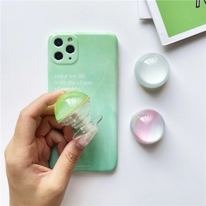 Detailed view of mint marble phone case with colorful transparent bubble pop sockets